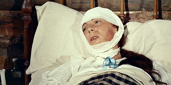 Tota Alba as Mrs. Carter, Billy's mom, recovering from her burn injuries in Billy the Kid (1964)