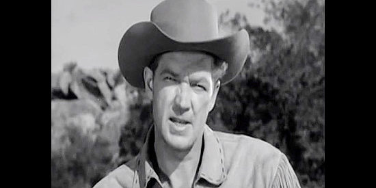 Bill Williams as Jim Henry, warning Aaron Baring of the danger of barging onto Indian land with a wagon train in The Wild Dakotas (1956)