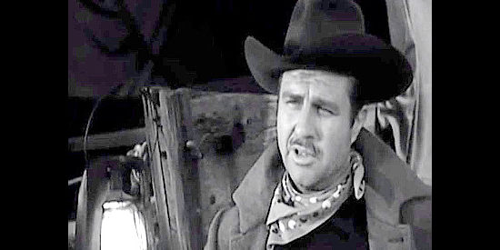 Jim Davis as Aaron Baring, the hard-driving wagon train captain with ulterior motives in The Wild Dakotas (1956)