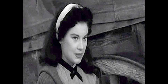 Lisa Montell as Ruth Murphy, trying to charm one of Aaron Baring's allies in The Wild Dakotas (1956)