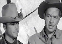 Dickie Jones as Mike McGeehee and Bill Williams as Jim Henry, bearing whip scars, address the Arapahoe chiefs in The Wild Dakotas (1956)