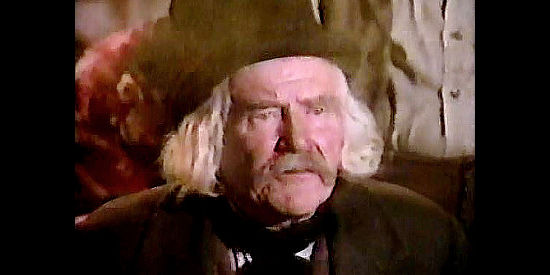 Will Greer as Judge Cotton, a gambling addict who loses everything just before his daughter is due to arrive in town in Honky Tonk (1974)