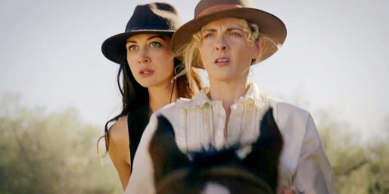 Hannah Jones as Nora and Chantelle Albers as Alice spotting a band of comancheros in Two Sinners and a Mule (2023)