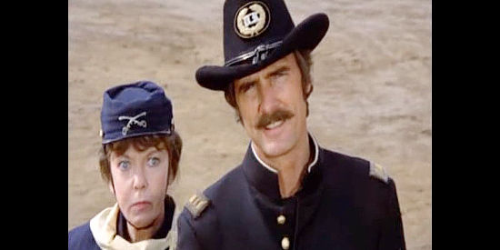 Ida Lupino as Martha Lindstrom and Dennis Weaver as Deke Chambers, donning cavalry uniforms to fool the Taggert gang in Female Artillery (1973)