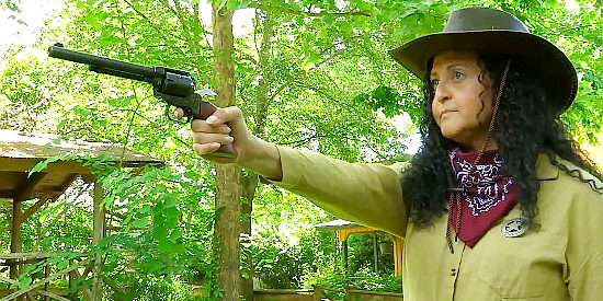 Serena Salieri as Marshal Nola Stone, a female lawman on a bank robber's trail in Vernon (2021)