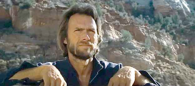 Clint Eastwood as Josey Wales, watching his new acquaintances at work on the ranch in The Outlaw Josey Wales (1976)