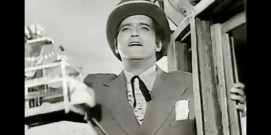 Abel Salazar as Cesar de Echague, holding a bird cage as he arrives home and climbs off a stagecoach in The Coyote (1955)