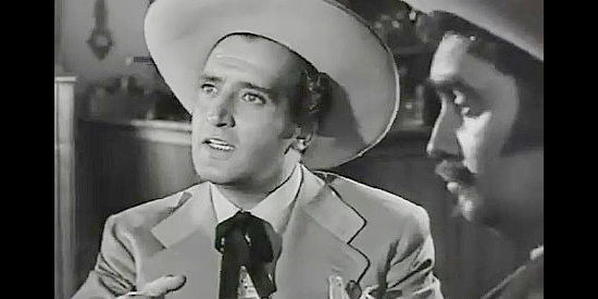 Abel Salazar as Cesar de Echague, trying to stop violence between Capt. Potts and his friend Artigas in The Coyote (1955)