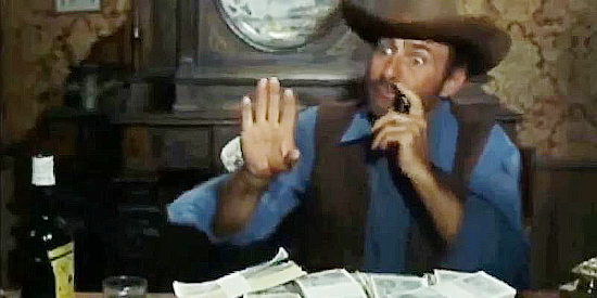 Alfredo Mayo as Slim, counting the profits from his thievery in The Magnificent Brutes of the West (1964)