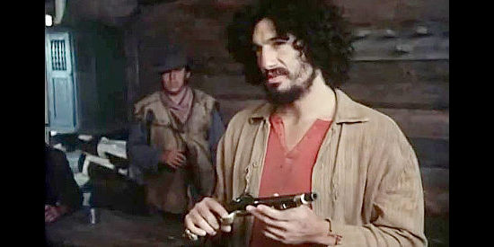 David Hess as Sleeve, one of the villains abusing settlers heading West in Montana Trap (1976)