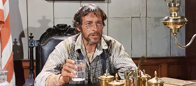 Francisco Sanz as Judge Parker, foreclosing on Maria Anderson's properties in Sartana Kills Them All (1970)