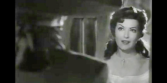 Gloria Marin as Leonor de Acevedo, getting a middle-of-the-night visit from The Coyote in The Coyote (1955)