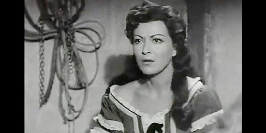 Gloria Marin as Leonor de Acevedo, in custody for her association with a masked avenger in The Coyote (1955)