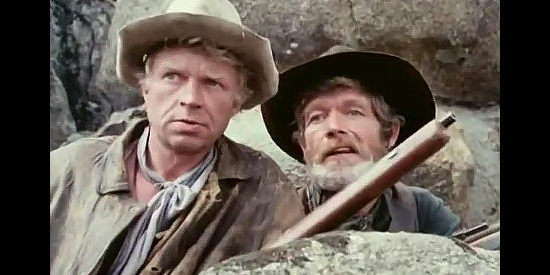 Hardy Kruger as Potato Fritz and Stephen Boyd as Bill Ardisson, teaming up to put an end to the mischief in Montana Trap (1976)