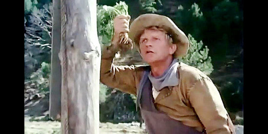 Hardy Kruger as Potato Fritz, cursing over a trampled potato crop in Montana Trap (1976)