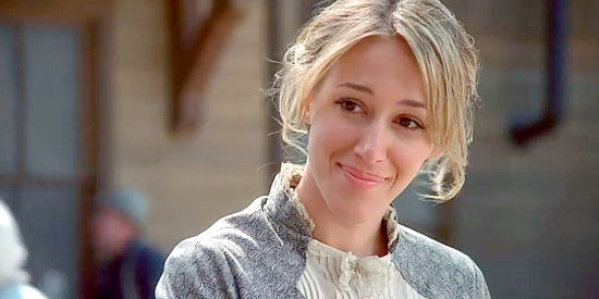 Haylie Duff as Annie, heading off to visit a friend while pregnant in Love Finds a Home (2009)