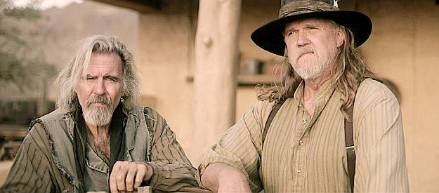 Jeff Fahey as Angel and Trace Adkins as Michael, contemplating how to help two church damsels in distress in Among Wolves (2023)