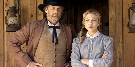 Jere Burns as Sheriff Holden and Julie Mond as Ellen Barlow discussing whether a young man fresh out of jail should work on her farm in Love Begins (2010)