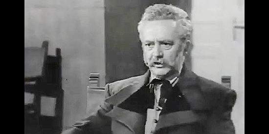 Julio Gorostegui as Senor Acevedo, Leonor's father, demanding her release from custody in The Coyote (1955)