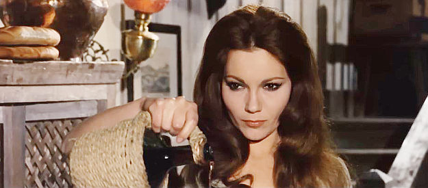 Maria Silva as Maria Anderson, preferring to pour out her liquor rather than sharing it with a lawman in Sartana Kills Them All (1970)