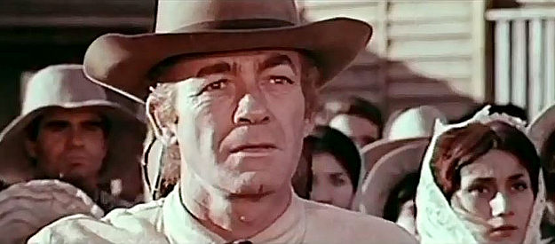 Mark Stevens as Sheriff Jess Kinley, recognizing Abel Dragna as he arrives in Fraserville in Sunscorched (1965)
