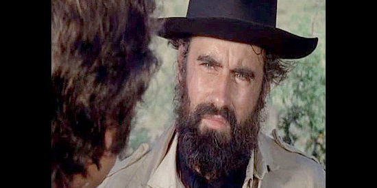 Martin LaSalle as Luis Comacho, a colleague of Simon Fuegus, insisting the gold be used for guns, not old debts in Hardcase (1972)