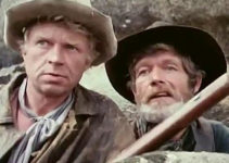 Hardy Kruger as Potato Fritz and Stephen Boyd as Bill Ardisson, teaming up to put an end to the mischief in Montana Trap (1976)