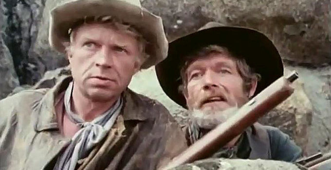 Hardy Kruger as Potato Fritz and Stephen Boyd as Bill Ardisson, teaming up to put an end to the mischief in Montana Trap (1976)