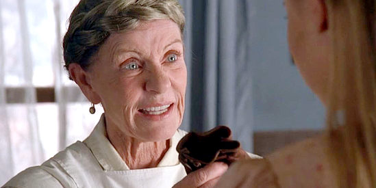 Patty Duke as Mary, presenting Doc Belinda with what she calls a sure-fire herb to induce birth in Love Finds a Home (2009)