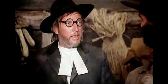 Peter Schamoni as The Rev. Cavenham, leading a new group of settlers into the area in Montana Trap (1976)