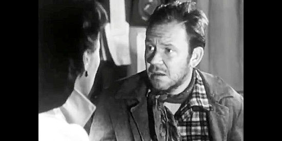 Richard Erdman as Shorty, Rick Nelson's partner, breaking a surprising bit of news to Adelaide McCall in The San Francisco Story (1952)