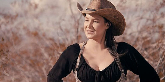 Saint Heart as the cold-blooded young lady who joins Hope and Cooper in Deadly Western (2023)
