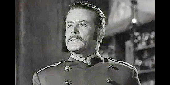 Santiago Rivero as Capt. Potts, reacting to a foe's sudden appearance in The Coyote (1955)