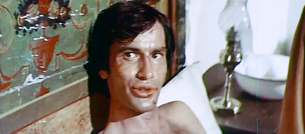 Simon Andreu as Stuart, recuperating from a beating at the hands of town bullies in I Do Not Forgive ... I Kill! (1968)