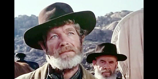 Stephen Boyd as Bill Ardisson, sharing the truth about who's been abushing settlers in Montana Trap (1976)