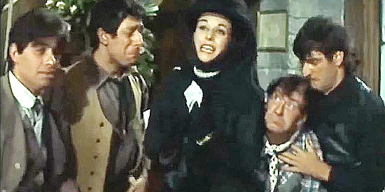 The four brutes, eager to help a lovely lady in her moment of grief in The Magnificent Brutes of the West (1964)