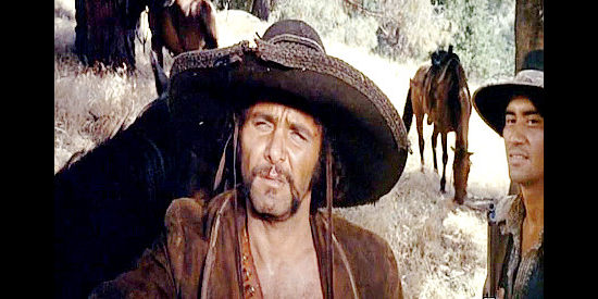 Bob Hoy as Romero, the leader of the Mexican bandits who pull a bank job with Avery Porter in A Man for Hanging (1972)