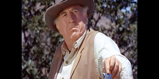 Ed Begley as John Cole, offering Brad Clinton a marshal's badge in The Silent Gun (1969)