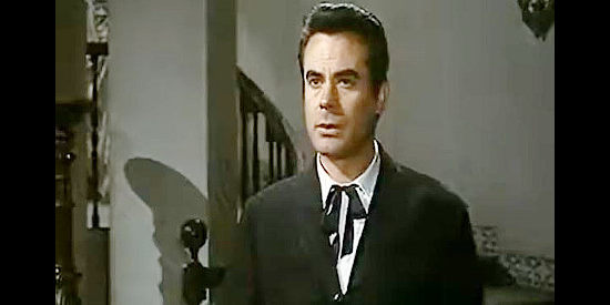 Fernando Casanova as Cesar Leon de Echague, considering a coward by the woman he loves because she doesn't know his secret in Sign of the Coyote (1963)