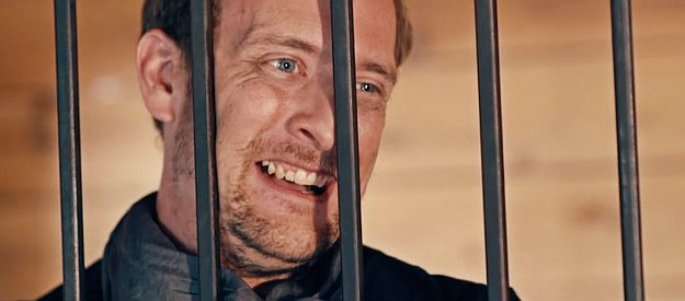 Jesse Marciniak as Jesse 'The Beast' Bristol, behind bars but still brash as ever in Showdown in Yesteryear (2023)