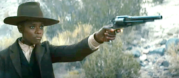 Letitia Wright as Mo Washington, left to guard a dangerous outlaw in Surrounded (2023)