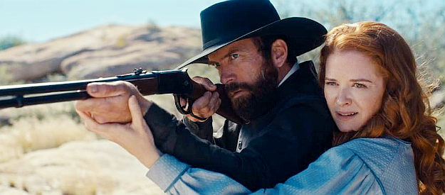 Lucas Black as Jeremiah Jacobs, trying to pick up some tips from his more gun savvy wife Martha Rose (Sarah Drew) in Birthright Outlaw (2023)