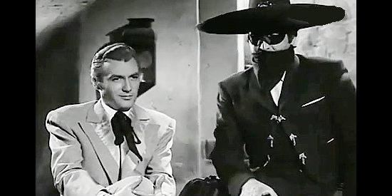 Manuel Monroy as Edmund Green and Abel Salazar as The Coyote, trying to figure out a way to stop Col. Clark without spilling lots of blood in Judgment of the Coyote (1956)