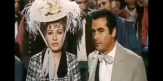 Maria Luz Galicia as Leonora Acevedo, alarmed by the lack of courtroom justice with Cesar Leon de Echague (Fernando Casanova) by her side in Sign of the Coyote (1963)