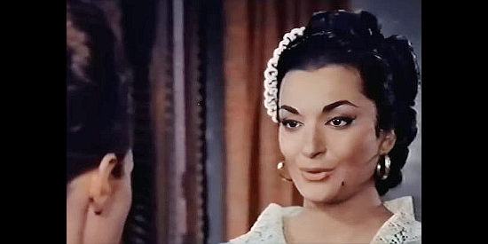 Mikaela (aka Mikaela Wood) as Maria, asking Virginia, the governor's bride to be, for help freeing her brother Diego from prison in Sword of Zorro (1963)