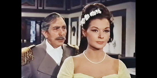 Antonio Prieto as Gov. Dan Manuel de Parades, attempting to change the attitude fiance Virginia de Santa Anna (Gloria Milland) has toward Zorro in Sword of Zorro (1963)
