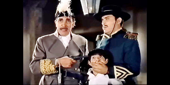 Antonio Prieto as Gov. Don Manuel Parades, threatening the life of young Diego in order to take Zorro into custody in Sword of Zorro (1963)
