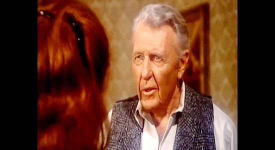 Ralph Bellamy as cattle king McVea, questioning the young woman who claims to be his long-lost daughter in Charlie Cobb (1977)