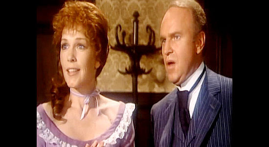 Stella Stevens as Martha McVea and George Furth as family attorney Tobia Conroy, reacting to McVea's acceptance of Charity as his daughter in Charlie Cobb (1977)