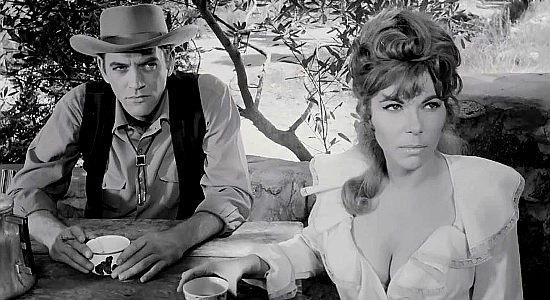 Beth, upset over how friendly Justin Kane is getting with her youngere sister while Jack Slade (Brad Thomas) looks on in Mark of the Gun (1969)
